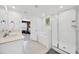 Bright bathroom with a dual sink vanity, soaking tub, and glass enclosed shower at 17741 Tawny Malt Pl, Land O Lakes, FL 34638