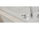 Close up of a white bathtub with chrome fixtures at 17741 Tawny Malt Pl, Land O Lakes, FL 34638