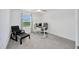 Bright bedroom with a window, ceiling fan, and a desk at 17741 Tawny Malt Pl, Land O Lakes, FL 34638