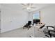 Bedroom with a ceiling fan, window, desk, and chair at 17741 Tawny Malt Pl, Land O Lakes, FL 34638