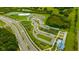 Aerial shot showcasing the community's amenities including a community garden and ample parking at 17741 Tawny Malt Pl, Land O Lakes, FL 34638