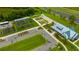 Aerial photo of community garden, parking, and center with landscaped green spaces and walkways at 17741 Tawny Malt Pl, Land O Lakes, FL 34638