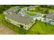 An aerial view of the exterior of a modern townhome community with beautiful landscaping at 17741 Tawny Malt Pl, Land O Lakes, FL 34638