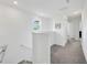 Bright hallway with carpet flooring leading to other rooms at 17741 Tawny Malt Pl, Land O Lakes, FL 34638