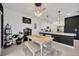 Bright kitchen and dining area with stainless steel appliances and modern decor at 17741 Tawny Malt Pl, Land O Lakes, FL 34638