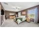 Spacious main bedroom with ample natural light, neutral carpet, and elegant furnishings at 17741 Tawny Malt Pl, Land O Lakes, FL 34638