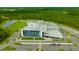 Aerial view of a large modern school complex featuring ample parking and athletic fields at 17741 Tawny Malt Pl, Land O Lakes, FL 34638