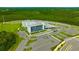 Aerial view showcasing the expansive parking facilities and surrounding greenery of this modern school at 17741 Tawny Malt Pl, Land O Lakes, FL 34638