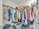 Walk-in closet with wire shelving and an abundance of hanging clothes and storage items at 17741 Tawny Malt Pl, Land O Lakes, FL 34638