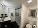 Bathroom featuring glass shower, vanity, and decor at 17926 Calkins Ct, Spring Hill, FL 34610