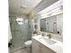 Bathroom featuring glass shower, vanity, and gold hardware at 17926 Calkins Ct, Spring Hill, FL 34610