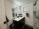 Modern bathroom with sleek vanity, marble countertop, and a glass-enclosed shower with marble tile at 17926 Calkins Ct, Spring Hill, FL 34610
