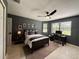 Bedroom with a ceiling fan and work space, tiled floors at 17926 Calkins Ct, Spring Hill, FL 34610
