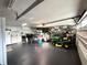 Spacious garage featuring ample storage, garage door, and durable black flooring at 17926 Calkins Ct, Spring Hill, FL 34610