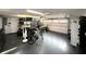 Spacious garage featuring ample storage, a garage door, and black flooring at 17926 Calkins Ct, Spring Hill, FL 34610