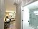 Hallway view into the bedroom and bathroom with glass shower at 17926 Calkins Ct, Spring Hill, FL 34610