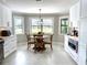 Cozy breakfast nook with a view, nestled in a modern kitchen with bright white cabinets and stainless appliances at 17926 Calkins Ct, Spring Hill, FL 34610