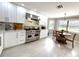 Bright eat-in kitchen featuring stainless steel appliances, ample cabinets, and an adjacent breakfast nook at 17926 Calkins Ct, Spring Hill, FL 34610