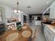 Open-concept kitchen and breakfast area features stainless appliances, bright cabinets and an inviting atmosphere at 17926 Calkins Ct, Spring Hill, FL 34610