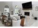 Inviting living room with stone fireplace, high ceilings, lots of natural light, and an open design at 17926 Calkins Ct, Spring Hill, FL 34610
