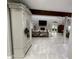 Open-concept living area with stone fireplace, high ceilings, and stylish decor at 17926 Calkins Ct, Spring Hill, FL 34610