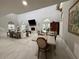 Open concept dining and living space with vaulted ceilings, stone fireplace, and natural light at 17926 Calkins Ct, Spring Hill, FL 34610