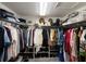 Organized walk-in closet featuring ample shelving and hanging space for clothes, shoes, and accessories at 17926 Calkins Ct, Spring Hill, FL 34610