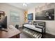 Cozy bedroom with a daybed, neutral decor, natural light, and decorative wall art at 1803 E Powhatan Ave, Tampa, FL 33610