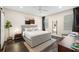 Bedroom with a large window, soft lighting, a rug, and a comfortable seating area at 1803 E Powhatan Ave, Tampa, FL 33610