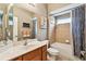 Cozy bathroom featuring a tub with shower, updated vanity, and a framed mirror at 2009 Raven Manor Dr, Dover, FL 33527