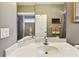 Well-lit bathroom featuring a large mirror, single sink vanity and a shower-tub combination at 2009 Raven Manor Dr, Dover, FL 33527