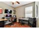 Bedroom featuring a wooden desk, large monitor, keyboard, and ample workspace for work or gaming at 2009 Raven Manor Dr, Dover, FL 33527