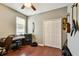 Bedroom with wood floors, closet, and a window providing plenty of natural light at 2009 Raven Manor Dr, Dover, FL 33527