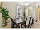 This dining room offers a stylish table, lots of natural light and a decorative plant at 2009 Raven Manor Dr, Dover, FL 33527