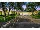 Charming home featuring a well-manicured lawn, lush landscaping, and a spacious three-car garage at 2009 Raven Manor Dr, Dover, FL 33527