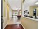 Inviting foyer with tile flooring leading to an open area with a pool table and a dining room at 2009 Raven Manor Dr, Dover, FL 33527