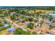 Charming neighborhood aerial shot showcasing a well-maintained home with nearby shopping and easy access to amenities at 208 Palmetto W Rd, Nokomis, FL 34275