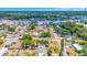 The aerial view showcases the property's location near lakes, roads, and lush green trees at 208 Palmetto W Rd, Nokomis, FL 34275