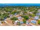 Beautiful area shot of a single-Gathering home surrounded by lush greenery, near coastal waters and stunning views at 208 Palmetto W Rd, Nokomis, FL 34275