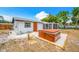 Private backyard featuring a hot tub, perfect for relaxation at 208 Palmetto W Rd, Nokomis, FL 34275
