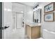 Contemporary bathroom featuring a modern vanity, tiled walls, and minimalist decor at 208 Palmetto W Rd, Nokomis, FL 34275