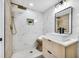 Stylish bathroom featuring walk-in shower, modern vanity, and elegant fixtures at 208 Palmetto W Rd, Nokomis, FL 34275