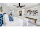 Serene bedroom showcasing stylish decor, ample lighting, and access to adjacent rooms at 208 Palmetto W Rd, Nokomis, FL 34275