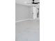 Bright bedroom with new white marble-look tile flooring, and ceiling fan at 208 Palmetto W Rd, Nokomis, FL 34275