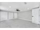 Bright bedroom with new white marble-look tile flooring, and closets at 208 Palmetto W Rd, Nokomis, FL 34275