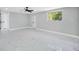 Spacious bedroom with new marble-look tile flooring and natural light at 208 Palmetto W Rd, Nokomis, FL 34275
