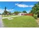 Beautiful home with mature landscaping, private fence, and a convenient carport at 208 Palmetto W Rd, Nokomis, FL 34275