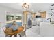 Gourmet kitchen features stainless steel appliances, granite countertops and a sliding door to the patio at 208 Palmetto W Rd, Nokomis, FL 34275