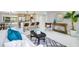 Spacious living room with a modern kitchen, white couch, and decorative accents at 208 Palmetto W Rd, Nokomis, FL 34275