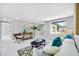 Bright living room with comfortable seating, stylish decor, and a view from the window at 208 Palmetto W Rd, Nokomis, FL 34275